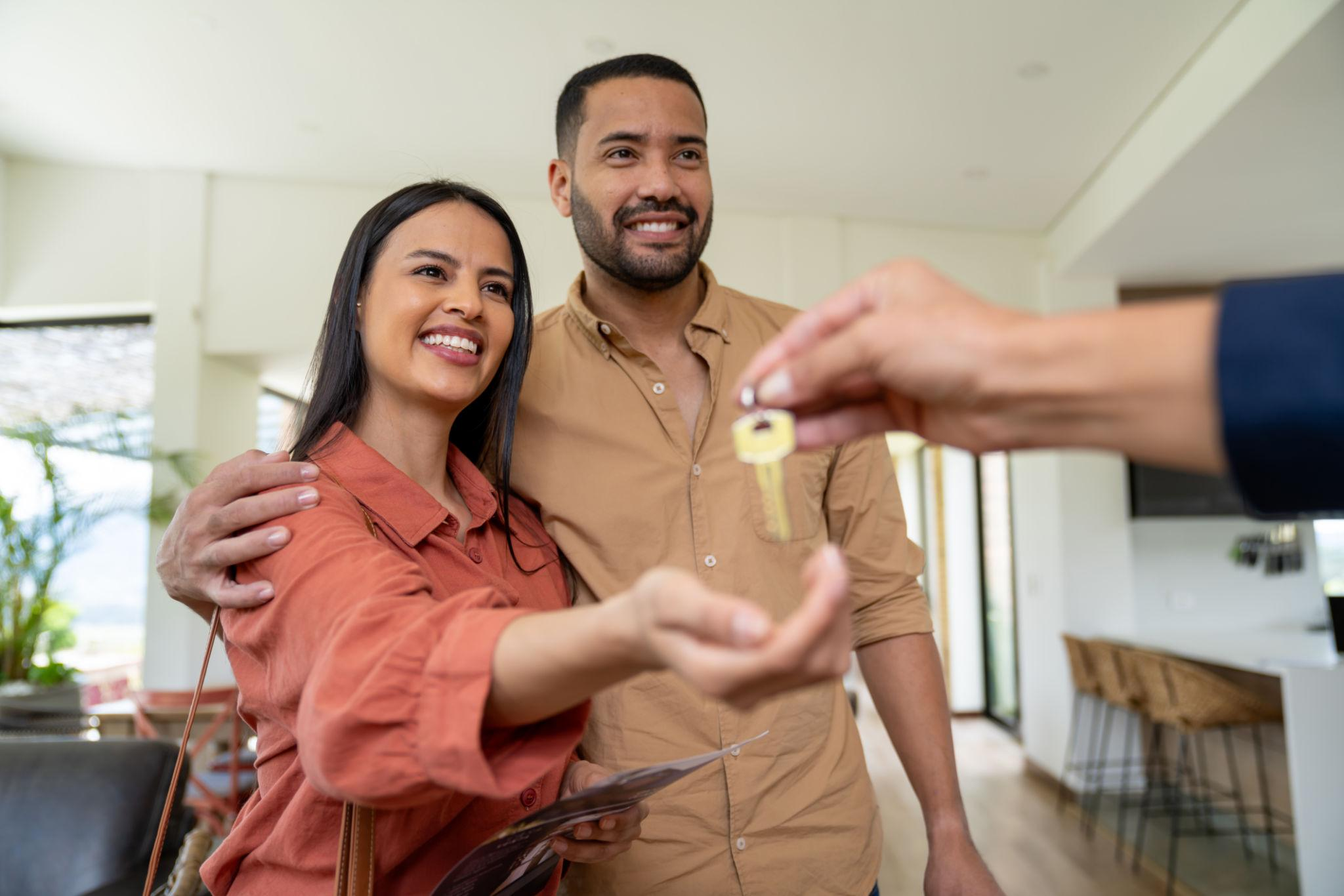 Couple receiving the keys to their new home