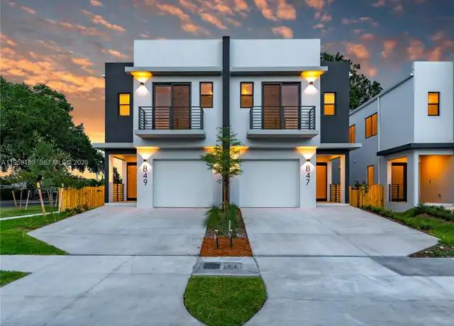 Modern newly built duplex at sunset